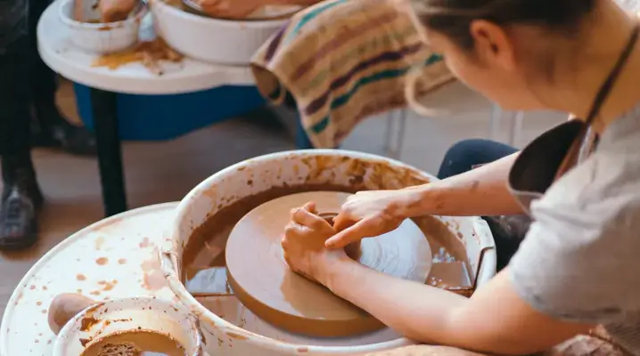 Student in a pottery or sculpture class