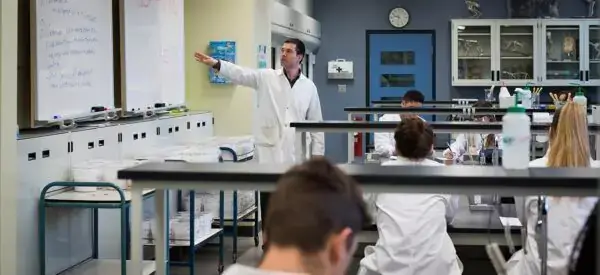 Instructor and students in science lab