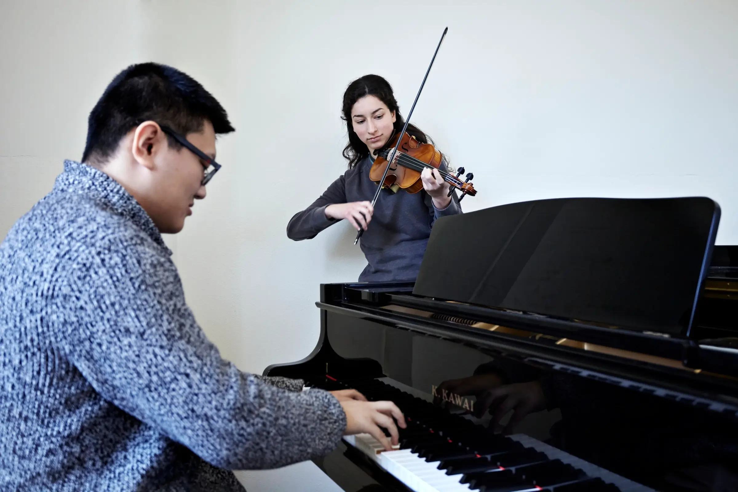 A small group of music students playing various instruments